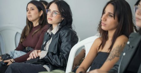 Four women with disinterested looks
